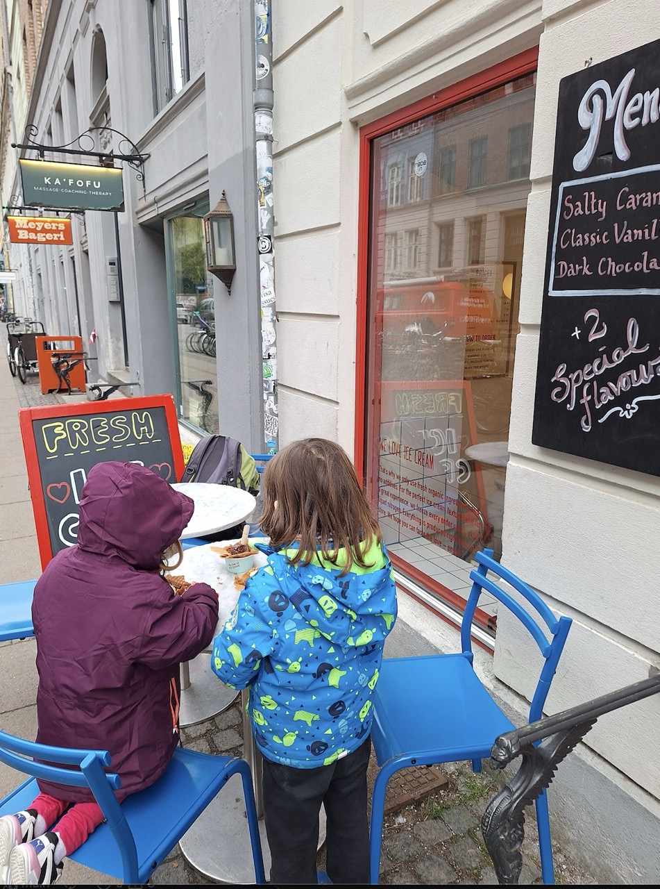 Kids eating ice cream at outdoor café