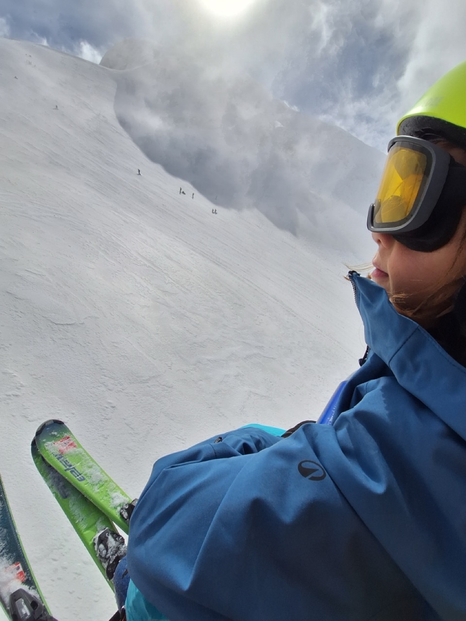 Kid selfie on the slopes with helmet and goggles